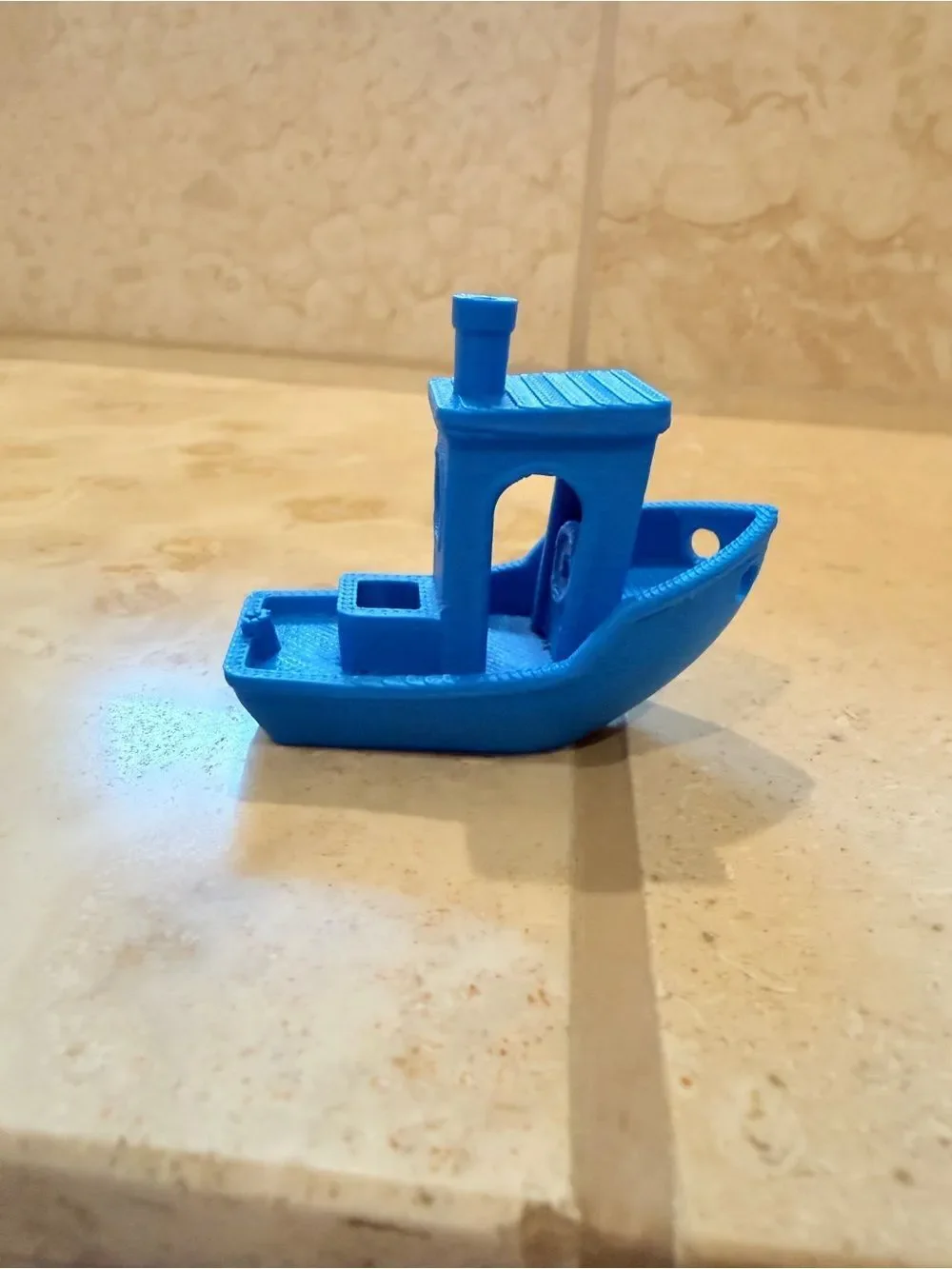 Small 3D-Printed Toy Boat in Bright Blue